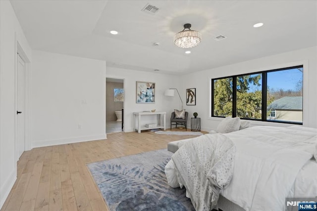 bedroom with light wood-style floors, baseboards, visible vents, and recessed lighting