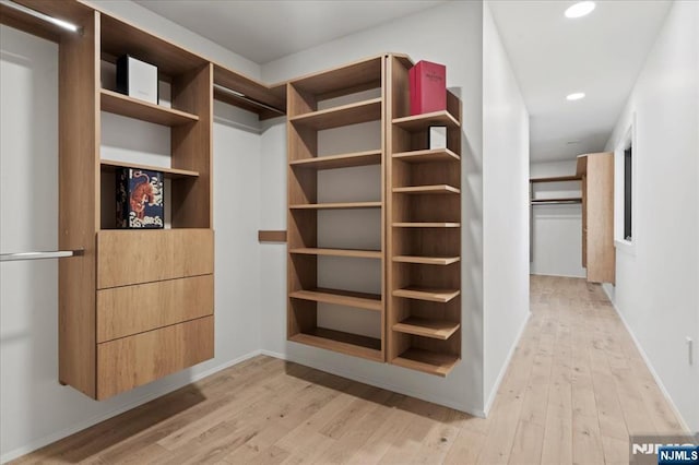 spacious closet with light wood-style flooring