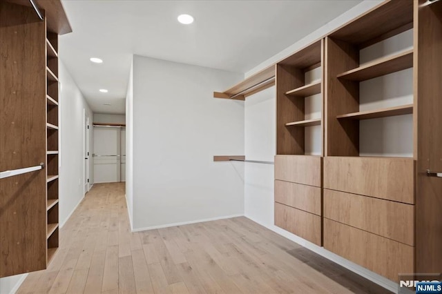 spacious closet with light wood-type flooring