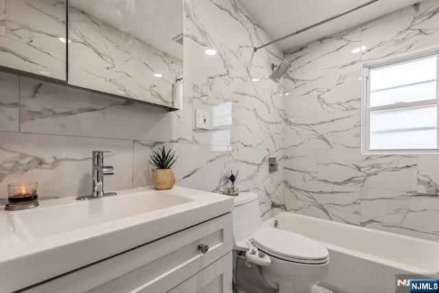 full bathroom with shower / bathing tub combination, vanity, and toilet