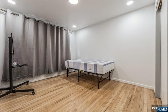 home office with recessed lighting, wood-type flooring, and baseboards