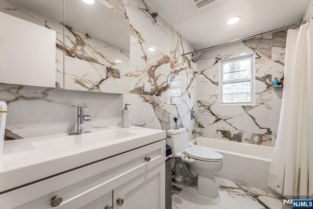 bathroom with toilet, visible vents, vanity, marble finish floor, and shower / bath combo with shower curtain