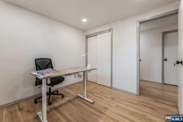 office featuring light wood-type flooring and recessed lighting