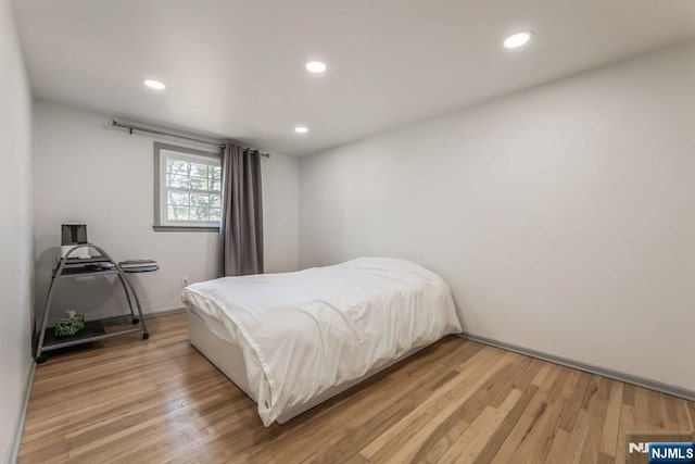 bedroom featuring recessed lighting and light wood-style flooring