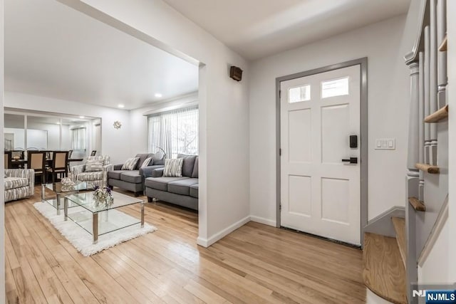 entryway featuring light wood-type flooring and baseboards