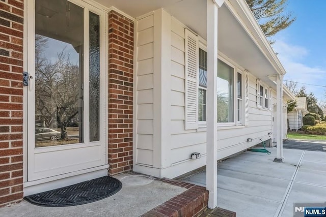 view of property exterior with brick siding