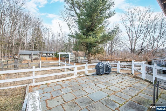 view of patio / terrace featuring grilling area and fence