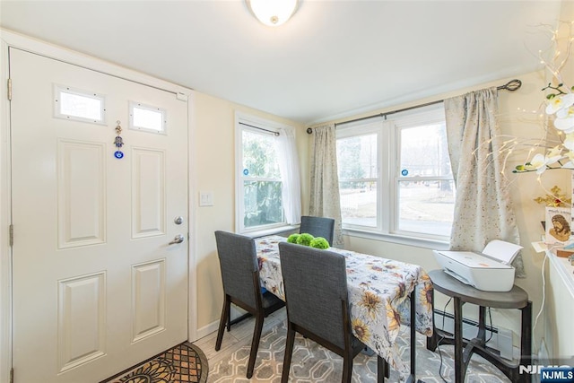 dining room with baseboards and baseboard heating