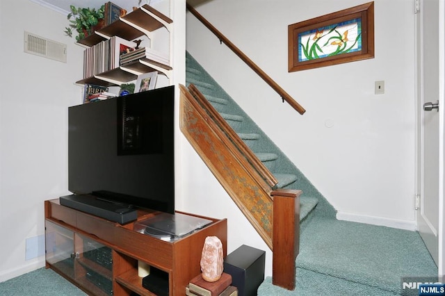 stairway with carpet, visible vents, and baseboards