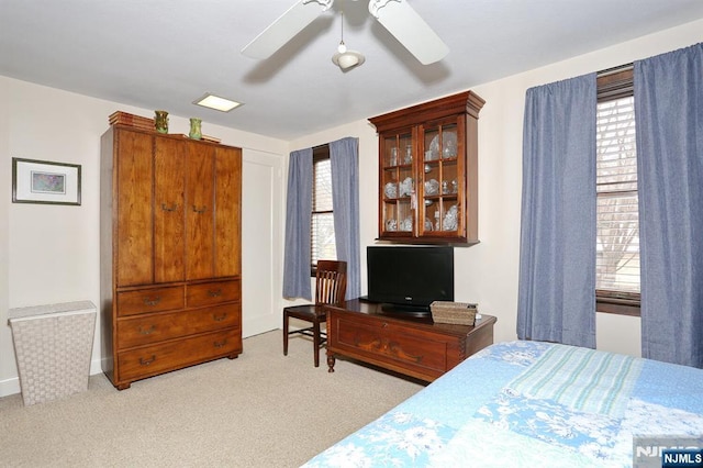 carpeted bedroom featuring a ceiling fan