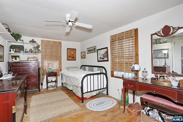 bedroom with ceiling fan and wood finished floors