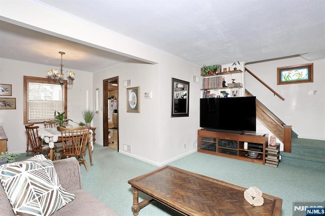 carpeted living area featuring stairs, baseboards, a chandelier, and crown molding