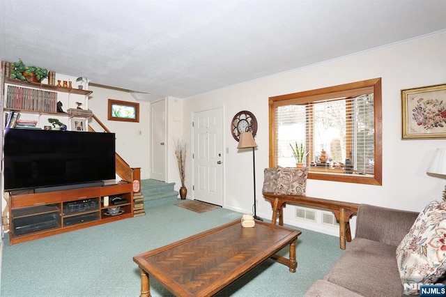 living area featuring carpet floors, visible vents, stairway, and ornamental molding