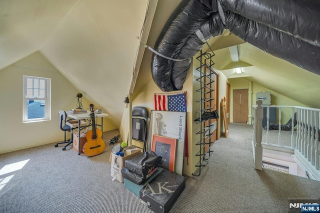 bonus room with lofted ceiling and carpet floors