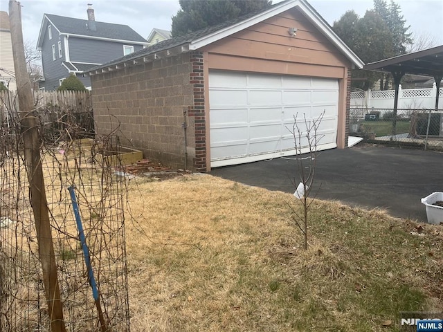 detached garage with fence