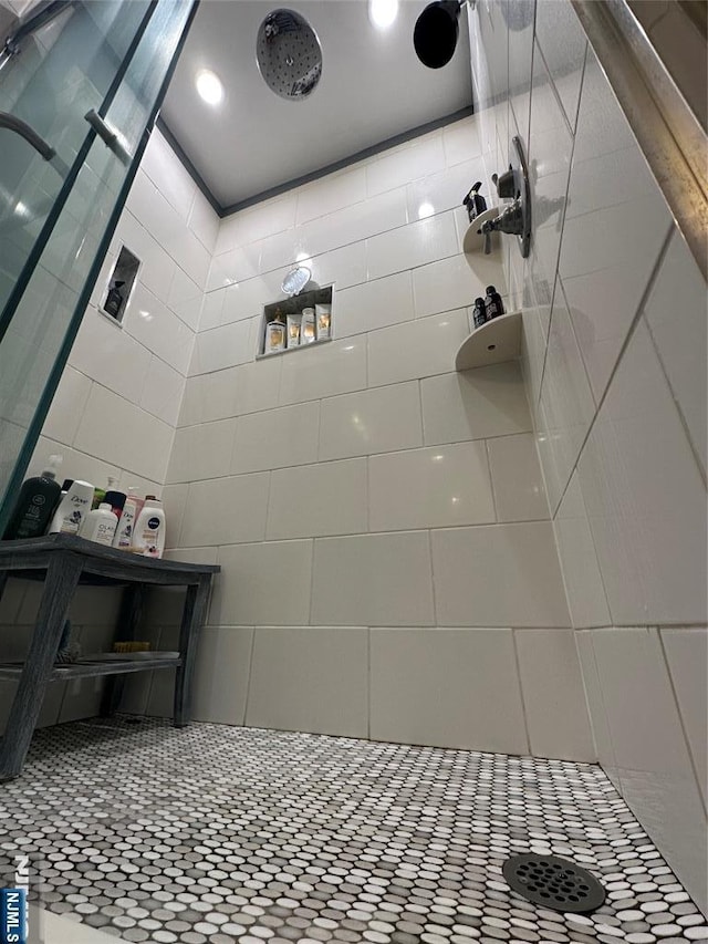 full bath featuring a tile shower