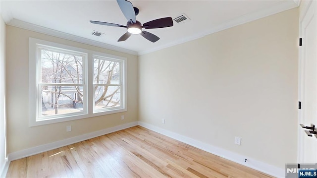 unfurnished bedroom featuring baseboards, ornamental molding, visible vents, and light wood-style floors