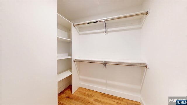 walk in closet featuring light wood-style floors