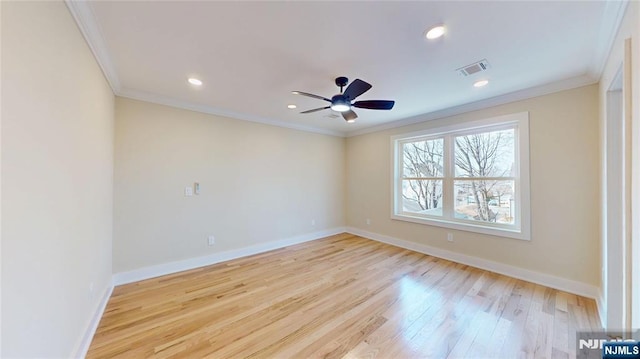 unfurnished room with recessed lighting, wood finished floors, visible vents, baseboards, and crown molding