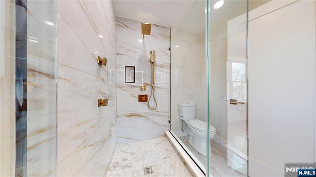 bathroom featuring a baseboard heating unit, a marble finish shower, and toilet