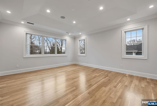 spare room featuring ornamental molding, visible vents, and recessed lighting