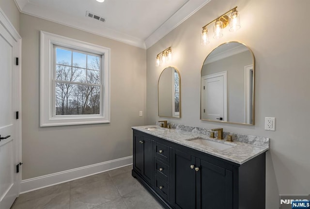 bathroom with double vanity, visible vents, ornamental molding, a sink, and baseboards