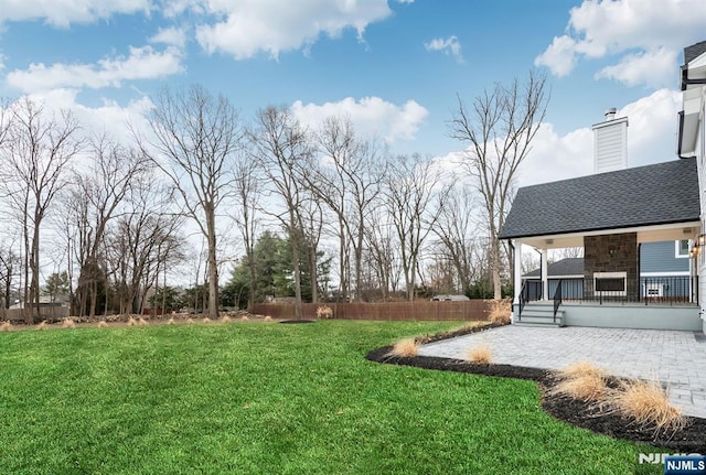 view of yard featuring a patio area and fence