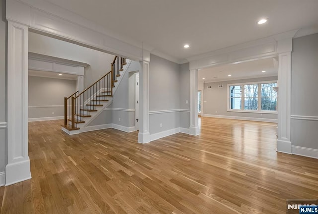 interior space featuring recessed lighting, stairway, light wood-type flooring, and baseboards