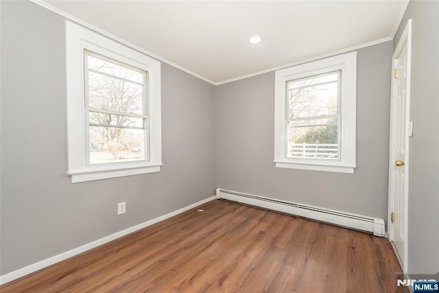 unfurnished room with baseboards, a baseboard radiator, wood finished floors, crown molding, and recessed lighting