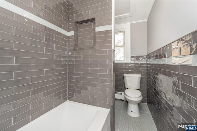 bathroom with a baseboard radiator, toilet, tile patterned floors, tile walls, and a tub