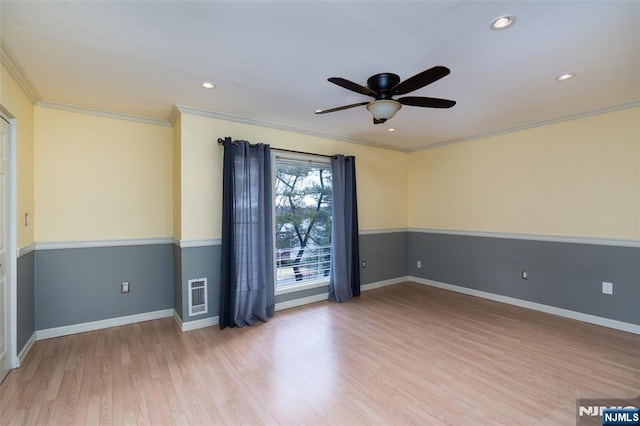 unfurnished room featuring recessed lighting, visible vents, baseboards, ornamental molding, and light wood-type flooring