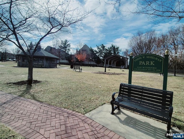 surrounding community featuring a gazebo and a yard