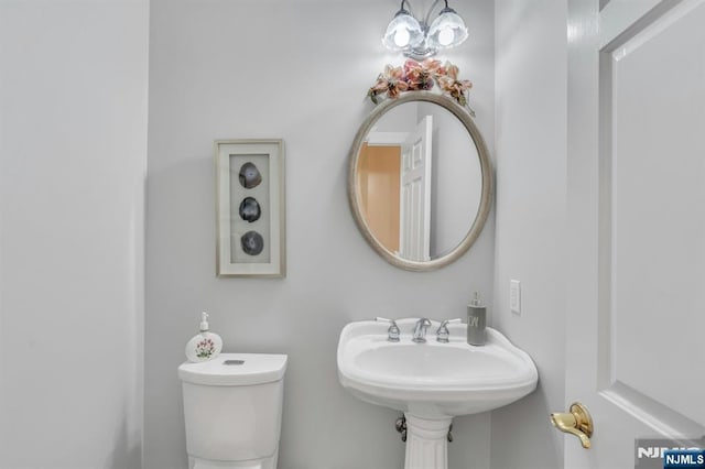 bathroom featuring a sink and toilet