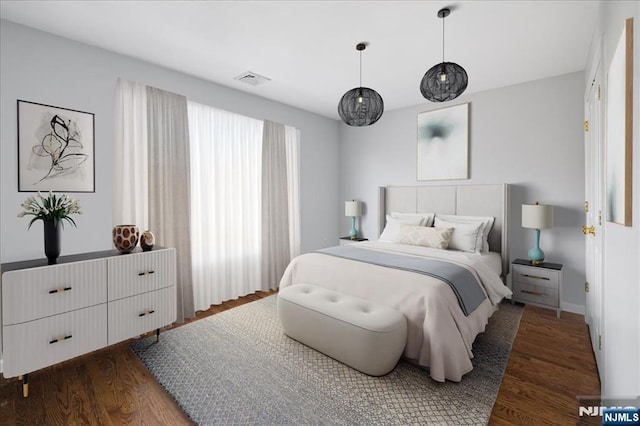 bedroom featuring dark wood-style flooring