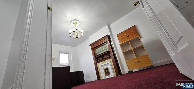 35 James St, Newark, NJ 07102 - carpeted living area featuring baseboards and an inviting chandelier
