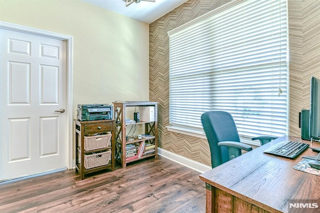 office featuring baseboards and wood finished floors