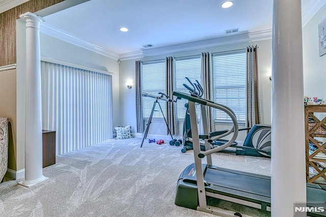 exercise area with carpet, decorative columns, visible vents, and crown molding