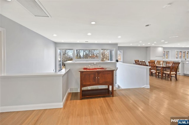 interior space featuring light wood-style floors, visible vents, and recessed lighting