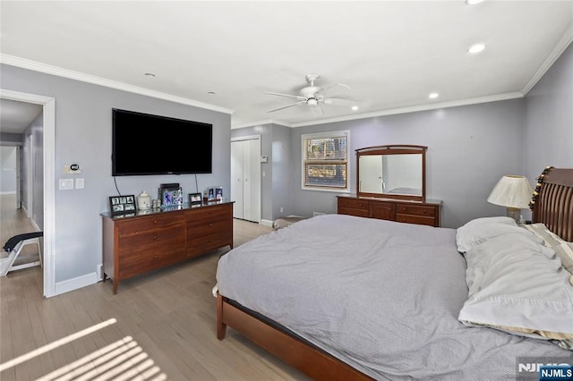 bedroom featuring recessed lighting, baseboards, wood finished floors, and ornamental molding