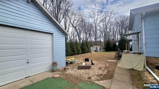 view of yard with a garage