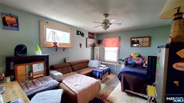 bedroom featuring ceiling fan and wood finished floors