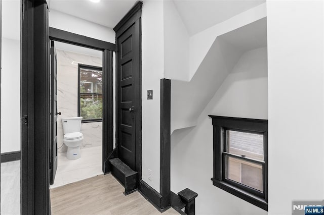 interior space with toilet and wood finished floors