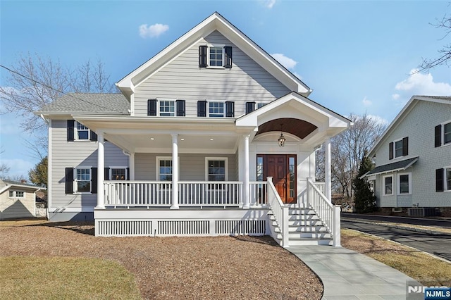 view of front of house featuring a porch and roof with shingles