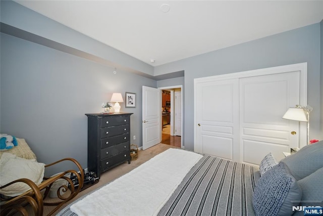 carpeted bedroom with a closet