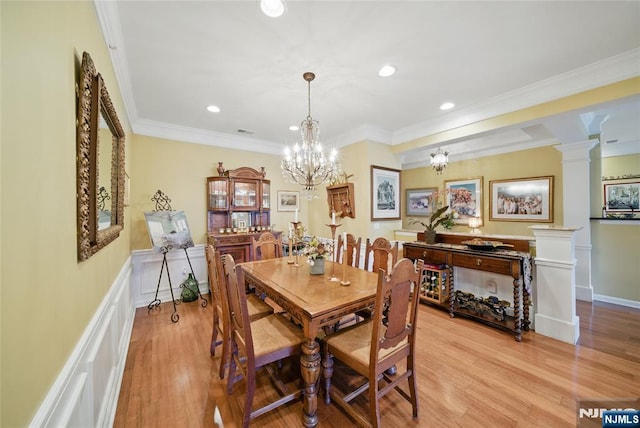 dining area featuring decorative columns, light wood finished floors, recessed lighting, visible vents, and ornamental molding