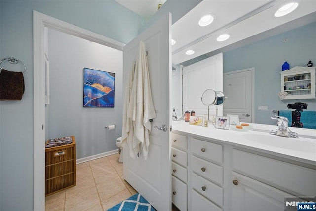 full bathroom with toilet, recessed lighting, vanity, baseboards, and tile patterned floors