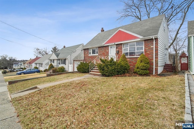 bungalow-style home featuring a front yard, a chimney, a residential view, and brick siding