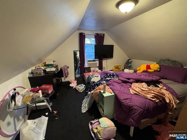 carpeted bedroom with cooling unit and vaulted ceiling