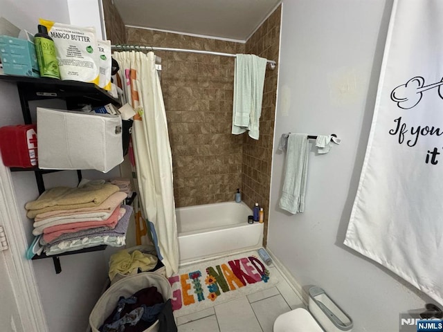 full bath with shower / tub combo with curtain and tile patterned floors