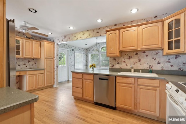 kitchen with stainless steel dishwasher, light brown cabinetry, white range with electric cooktop, and wallpapered walls